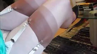 Faggot crossdresser shows stockings and hair 