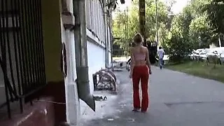 Cutie pissing right through sporty pants