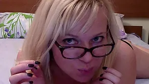 Desirable blonde with big tits does a great striptease show for the camera.