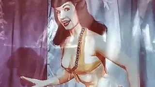 Vintage: Betty Page and Lucy Kraven posing and wrestling