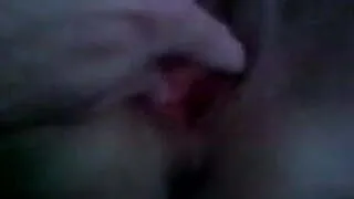 spreading her pierced pussy