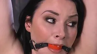 Brunette in metal device ass whipped