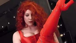Redhead wearing red boots a corset and pantyhose