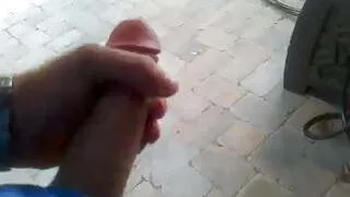 Public masturbation outdoor on patio with cumshot