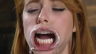 Natural busty redhead whipped in metal stock