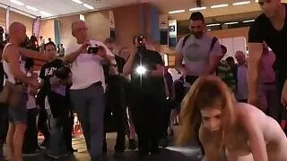 Brunette takes facial at Euro sex expo