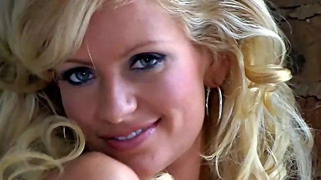 Glamorous blonde in sensual striptease