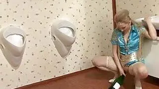 Bottle eating vagina aimed by a cock