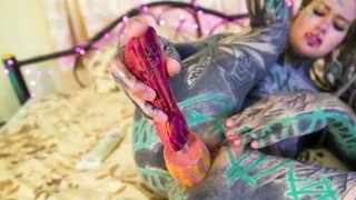 Tattooed girl fingering her pussy and ass