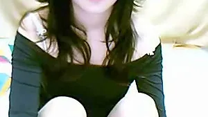 Horny web cam girl reaches intense orgasm.