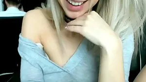 Clothed blonde hottie is masturbating having her legs spreaded.