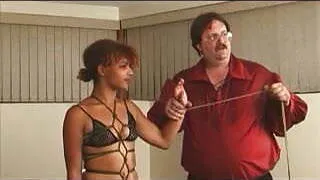 Hot BDSM couple binding and spanking