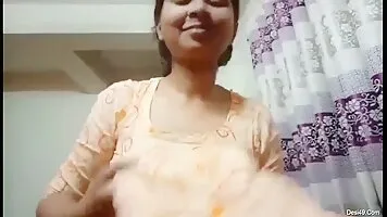 The Hot Stare of Desi Bhabha Undressing Her Clothes