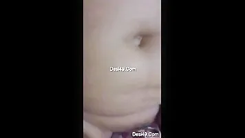 Sexy Desi Bhabhi jerking off her pussy with a Dewar.