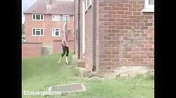 Woman peeing around the house