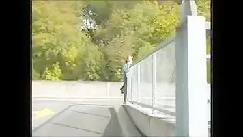 Woman pissing away from an underground parking