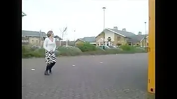 Woman pissing in the yellow container