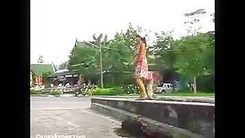 Woman pissing in town