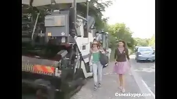 Woman pissing near the truck