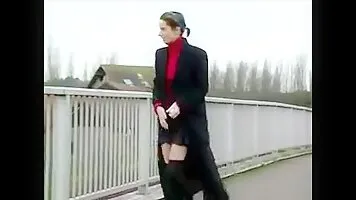 Woman pissing on the pedestrian bridge