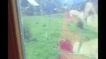 Woman scat in toilet with a beautiful view from the window