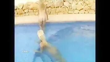 Two blondes scat in pool