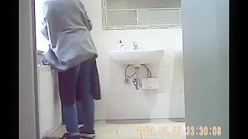Pissing girl. Hidden camera in the toilet