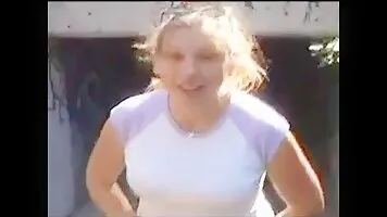 Liquid scat girl sitting on a log