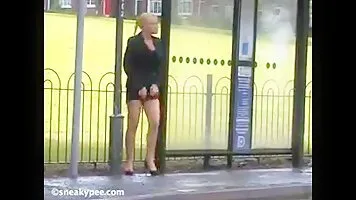 Little girl pee at a bus stop