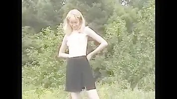 Nerd girl pissing on the lawn