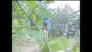 Girl with big tits pissing on a rural road