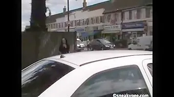 Girl pee in the street behind the car