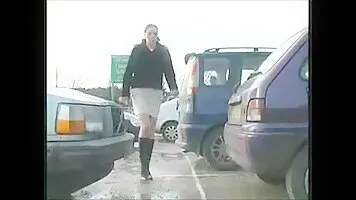 Girl peeing in the parking lot