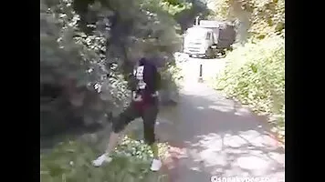 Girl pissing in the bushes