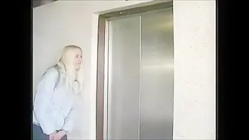 Girl pissing in the elevator