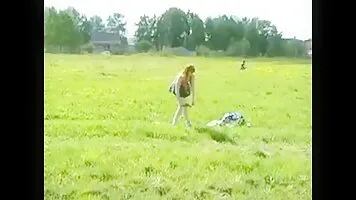 Girl pissing in the field