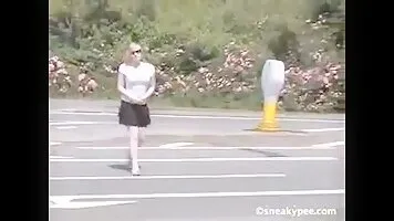 Girl pissing near the road