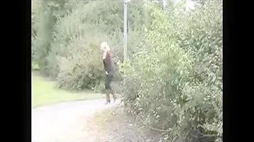 Girl in boots pissing on the track
