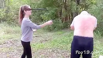 Five young girls poops into the mouth of an adult man in nature