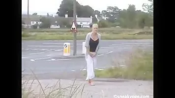 Cool girl pissing near the road