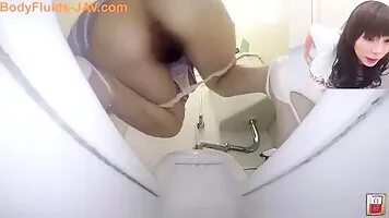 Cute Asian girls poop in a public restroom