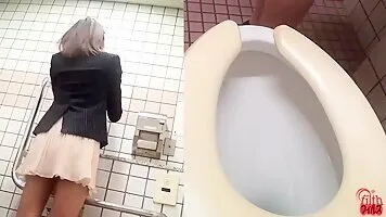 Cute asian girl pushing and pooping in the toilet