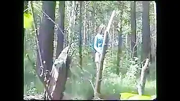 Cute girl peeing in the bushes