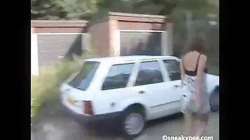 Bianca pissing behind the garage and shows his tits