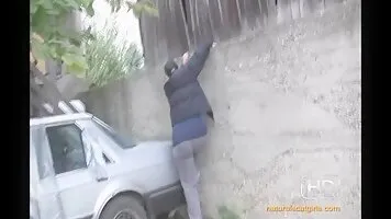 Big ass chick shit on the trunk of a car