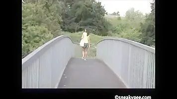 Black woman pissing on the pedestrian bridge