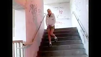 Blonde pissing on the stairs