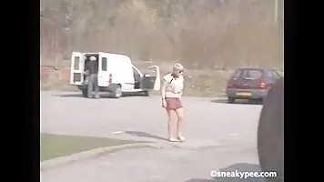 Chick piss sat on a green lawn