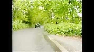 Chick pissing out the car window