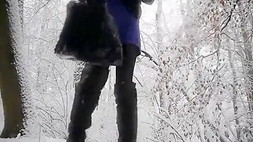 Amateur video pooping girl in the winter forest